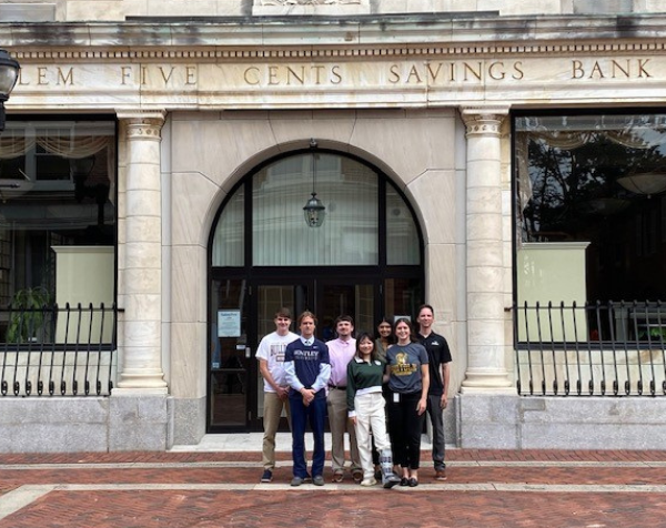 Seven Salem Five interns standing outside at 210 Essex Street in Salem, MA