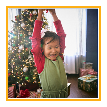 Young girl holding Christmas gift
